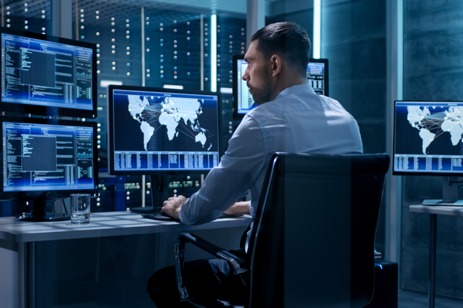 IT professional monitoring security in a network operations center in Singapore Gain a strategic advantage by partnering with Cybertools to fix problems before they impact performance and meet the evolving IT demand of your business